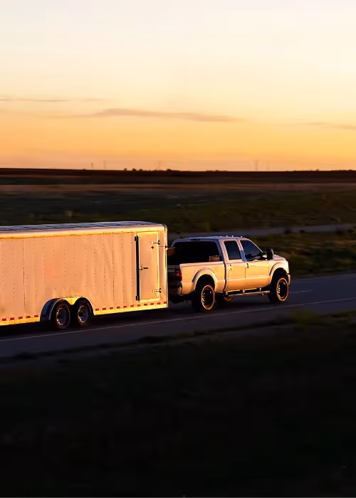 trailer being pulled in sunset