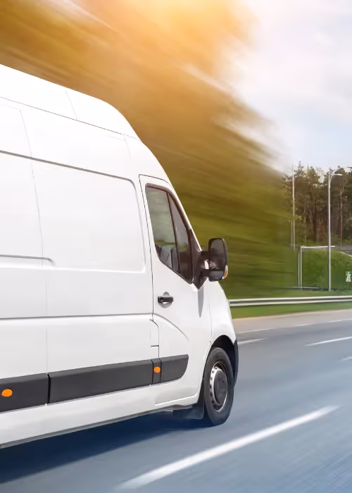 Van zooming down road