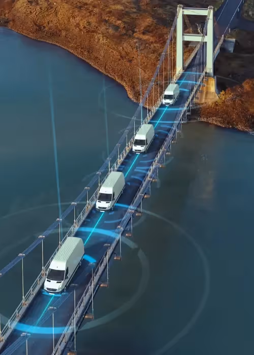 vans travelling across bridge with radius around them