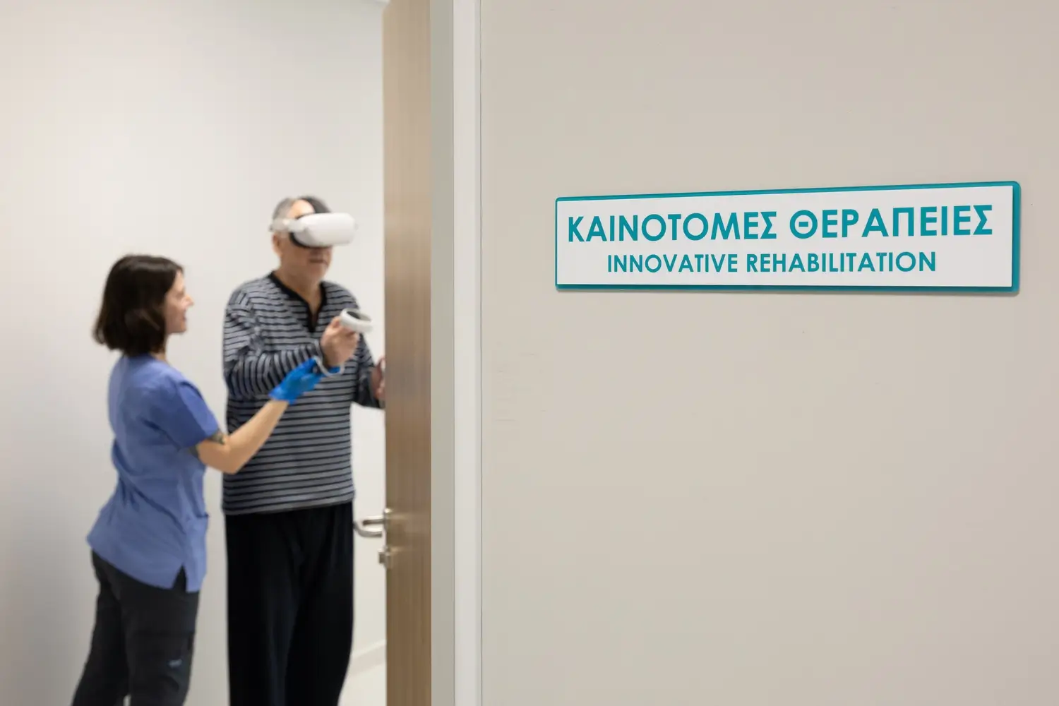 Clinician guiding a man wearing a virtual reality headset past a wall sign reading Innovative Rehabilitation
