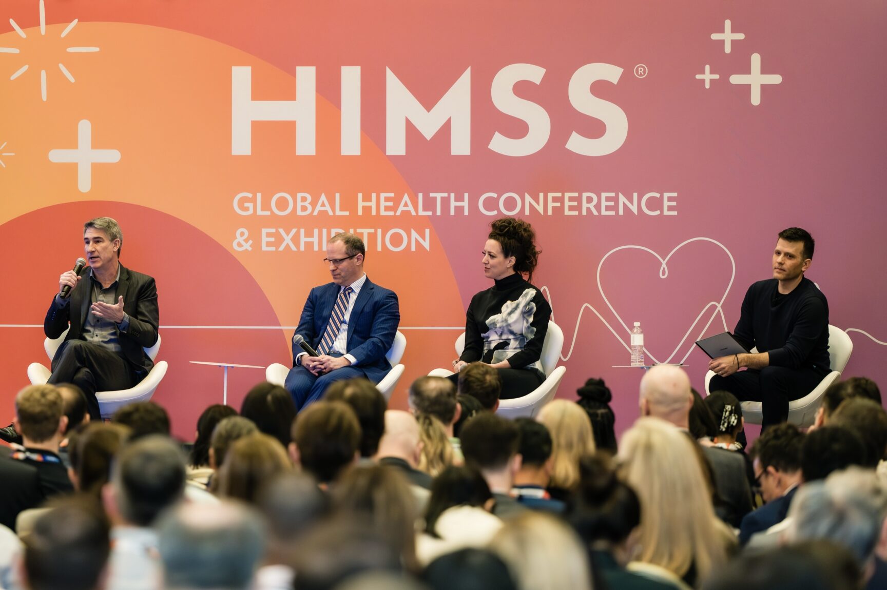 Dr. David Kirk speaking on a Microsoft panel at HIMSS 2026