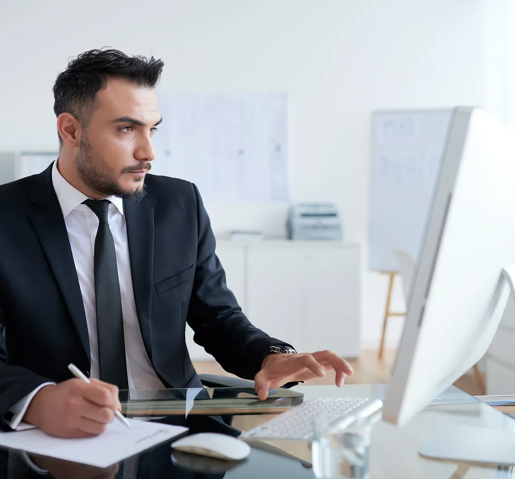 Businessman using a desktop computer