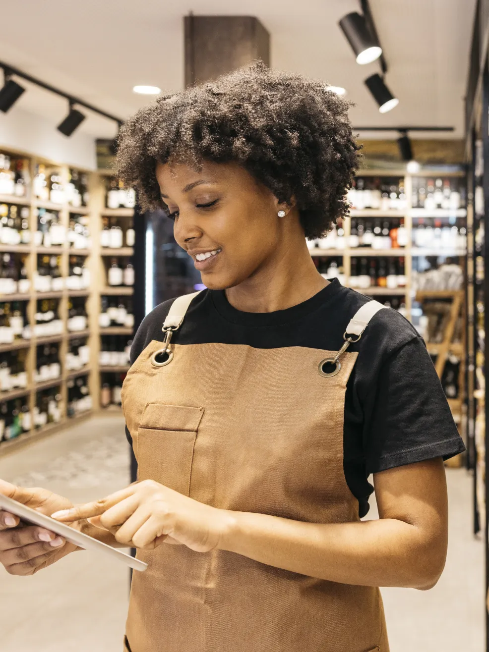 Shop worker using a tablet