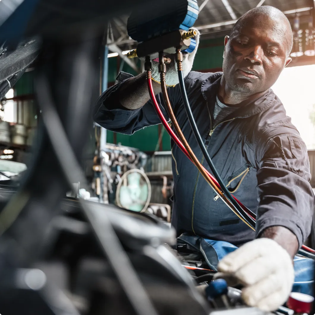 Mechanic working under a car