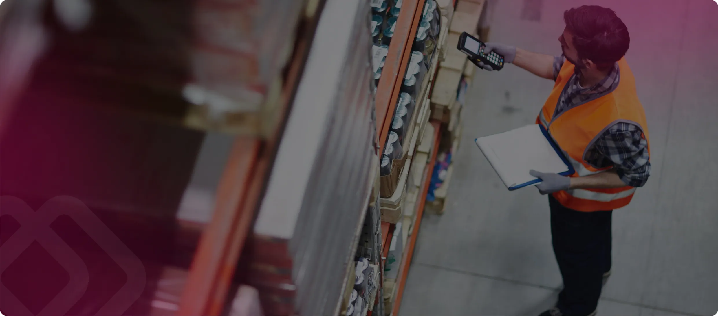 Worker with a clipboard by shelves