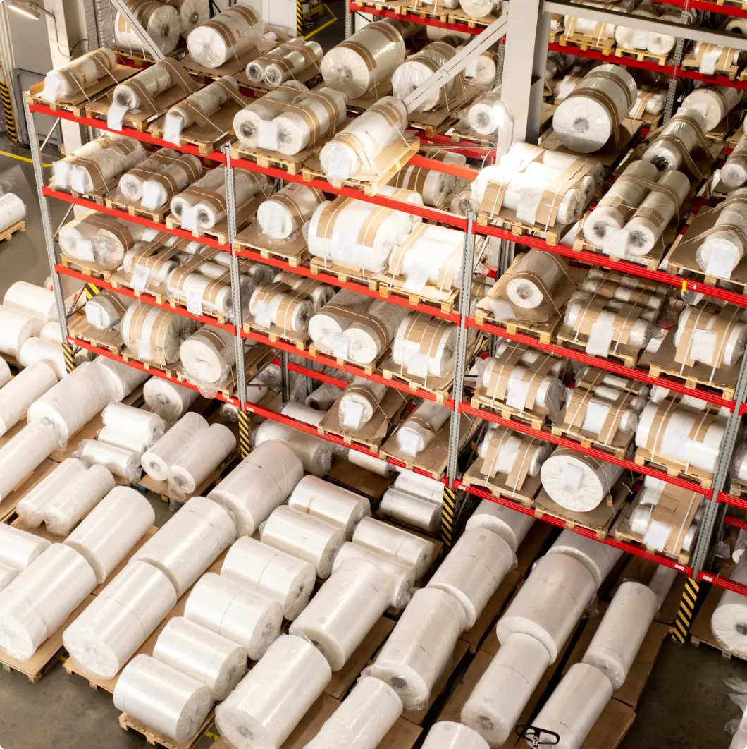 Rolls of material stored on racking
