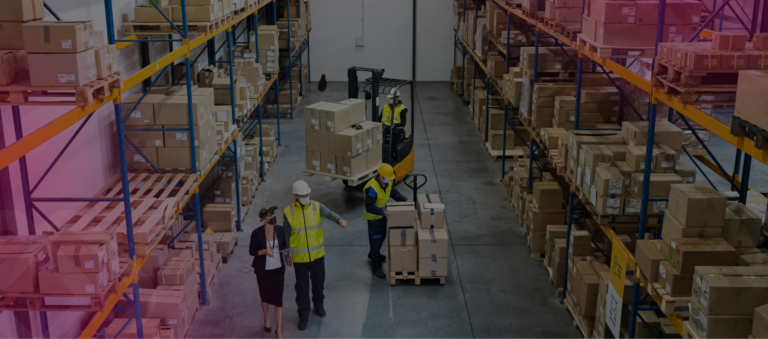 Workers in a warehouse aisle