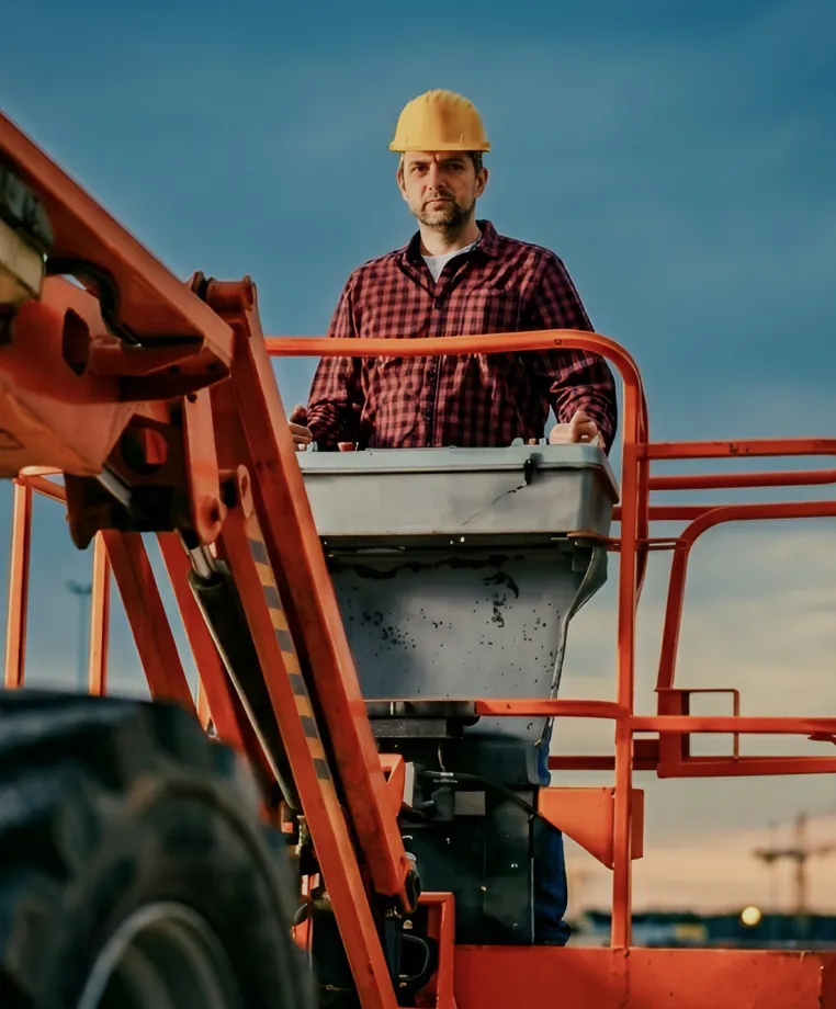Worker on a cherry picker platform