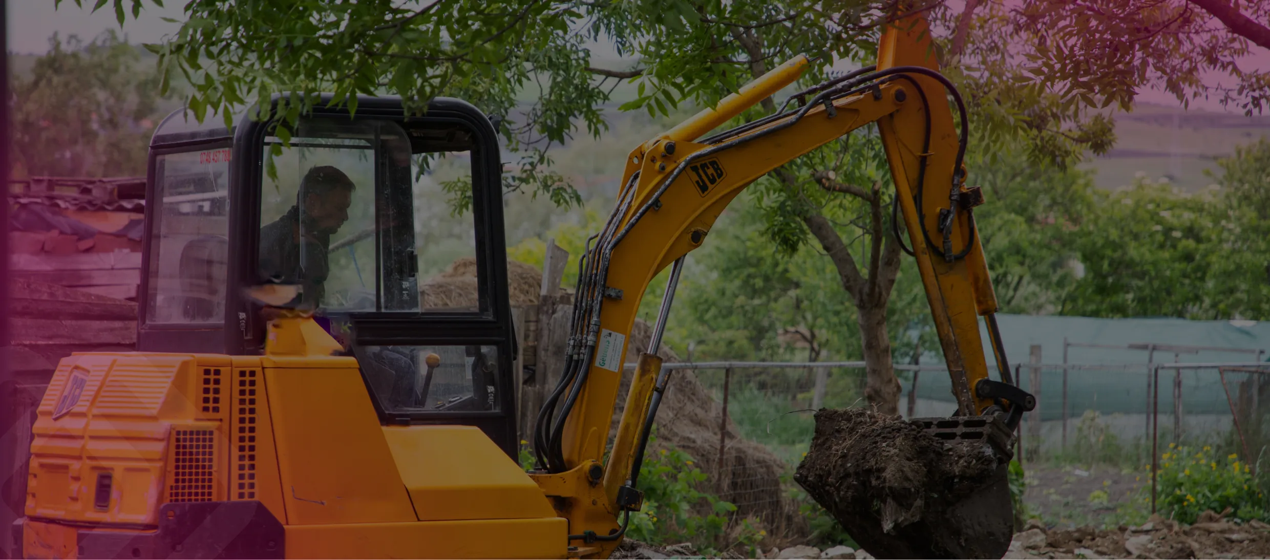 Excavator and roller on a construction site