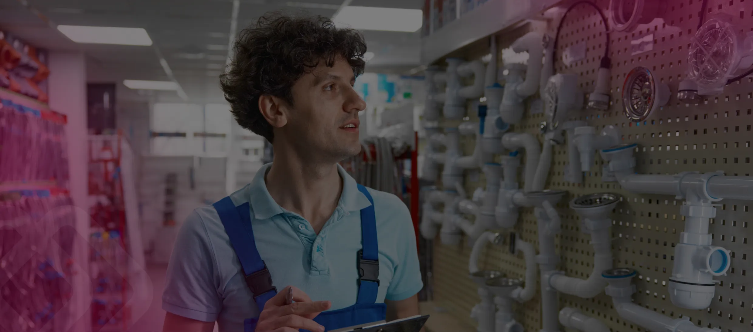 Worker among plumbing supplies in a store
