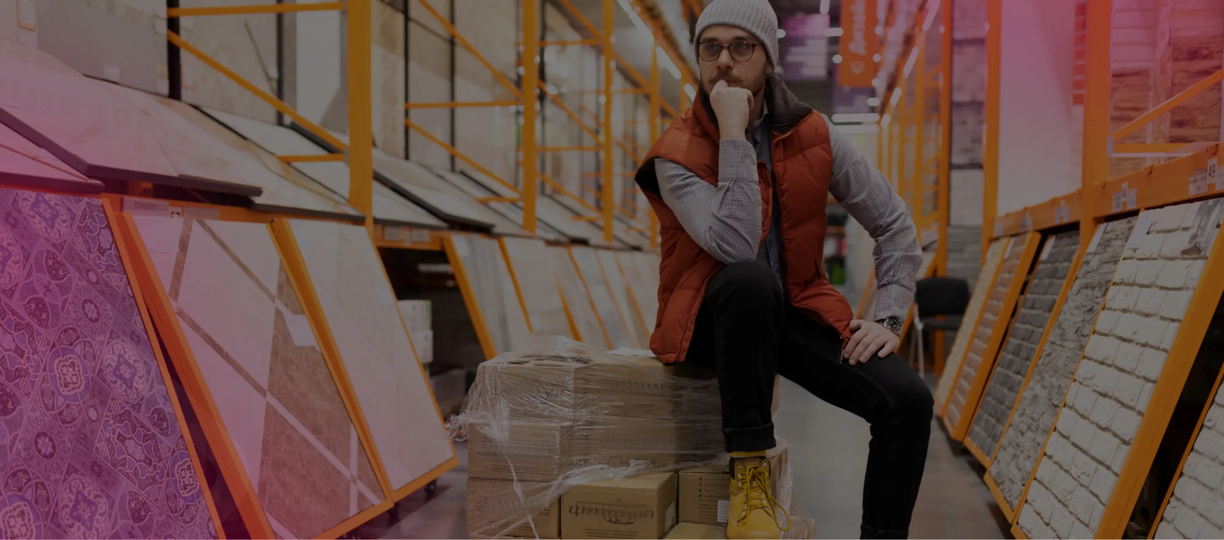 Worker using a phone in a warehouse
