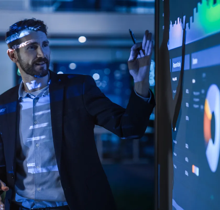 Businessman interacting with a data analytics screen