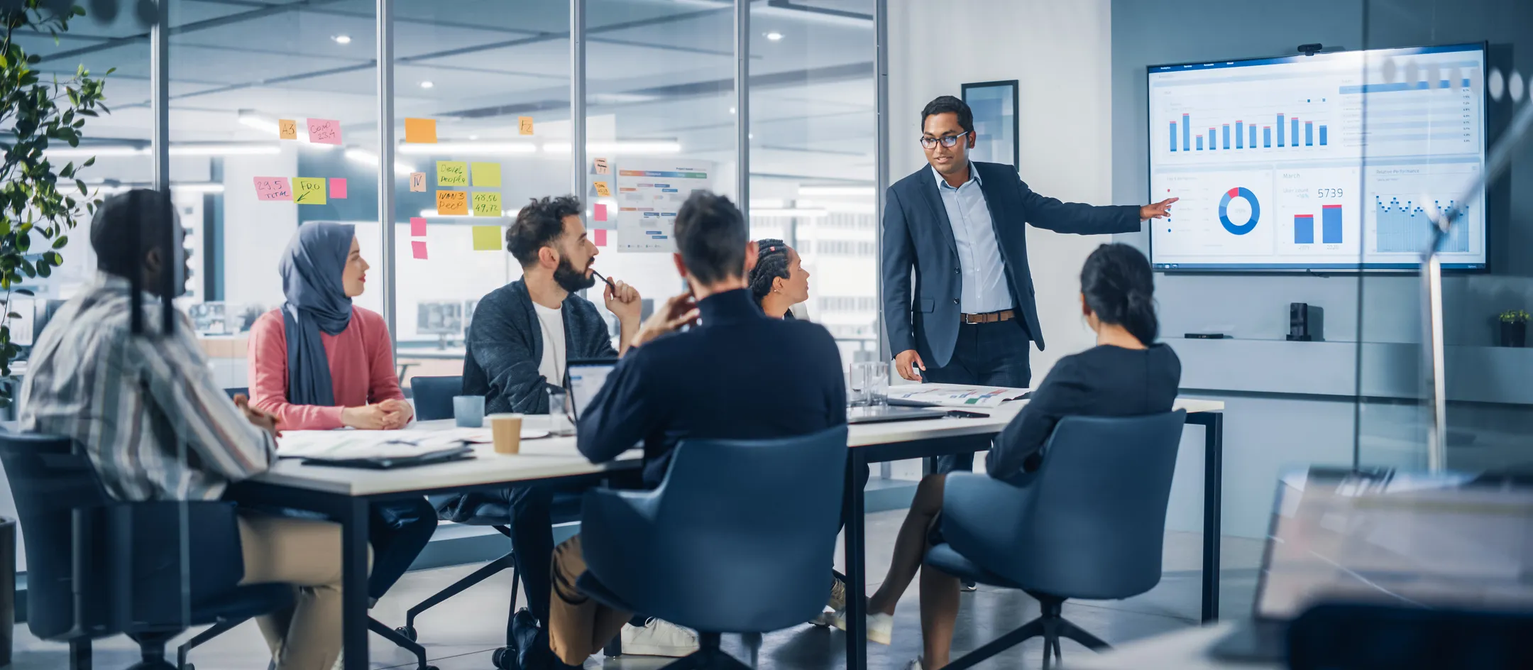 Team in a meeting room watching a presentation