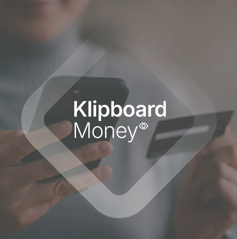 Klipboard Money graphic over a hand holding a card