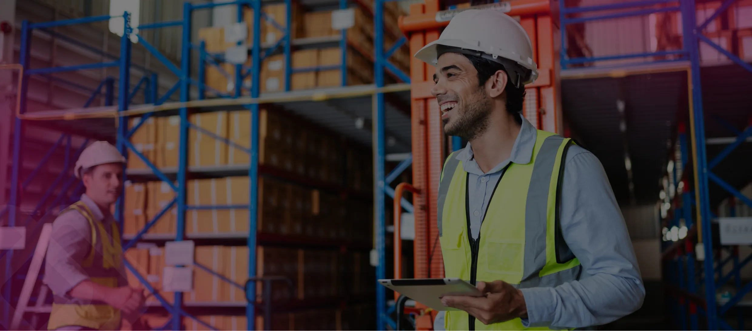 Worker with a laptop in a warehouse