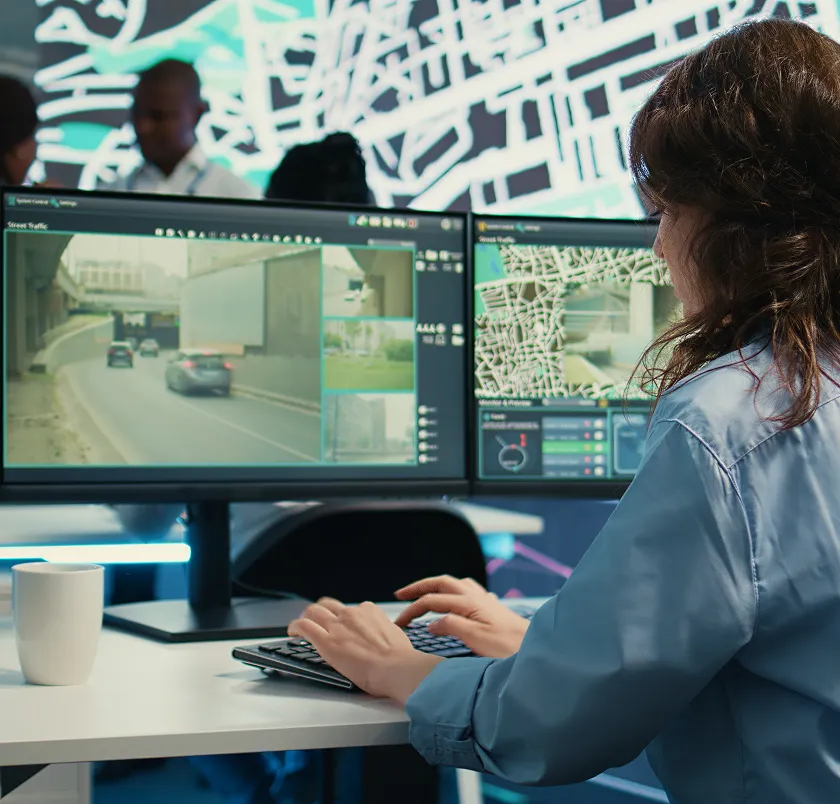 Operator monitoring fleet tracking on multiple screens