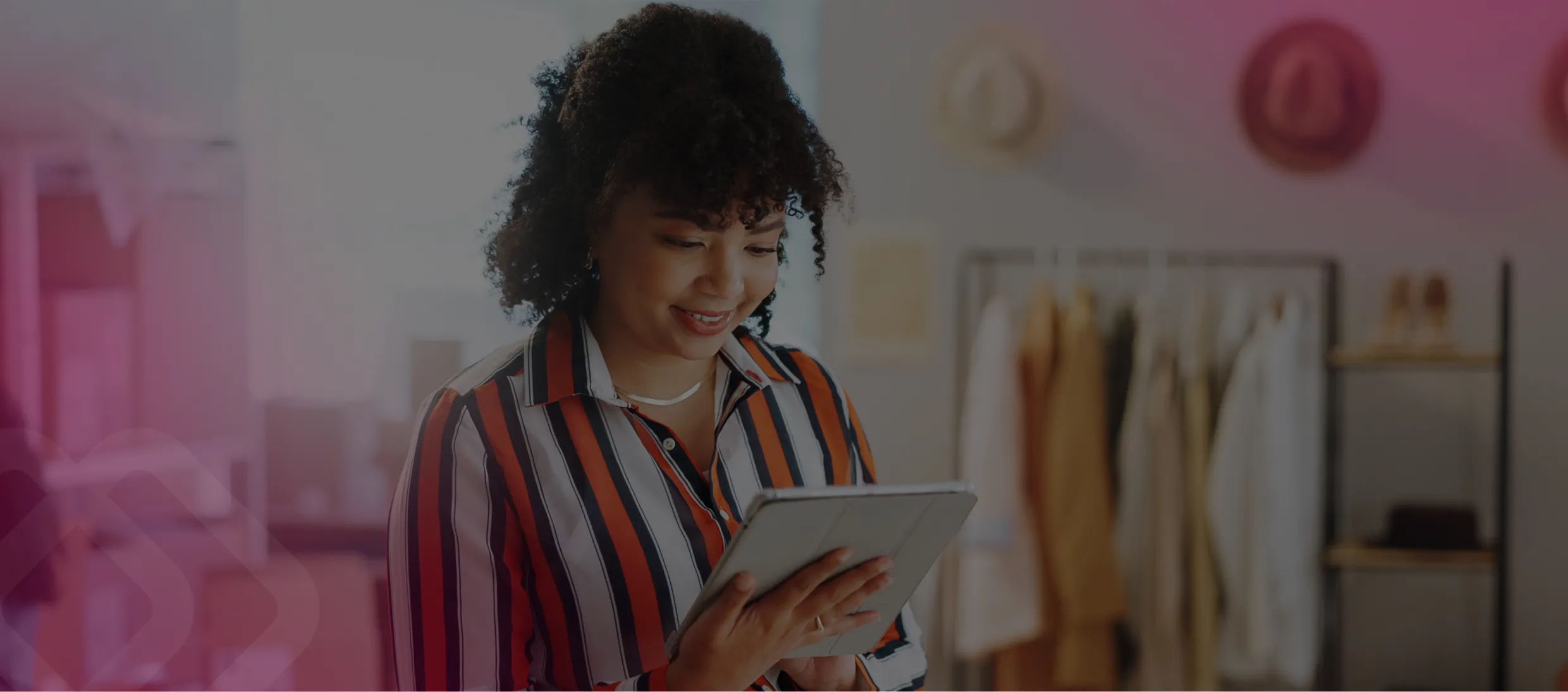 Woman using a tablet in a clothing shop