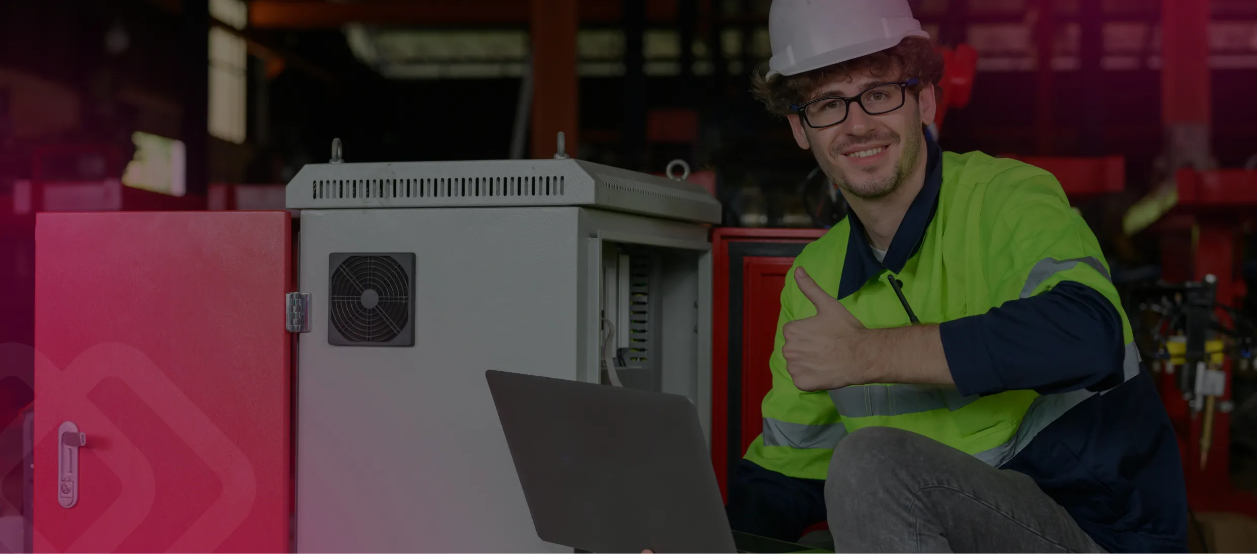 Worker in hi-vis with a laptop