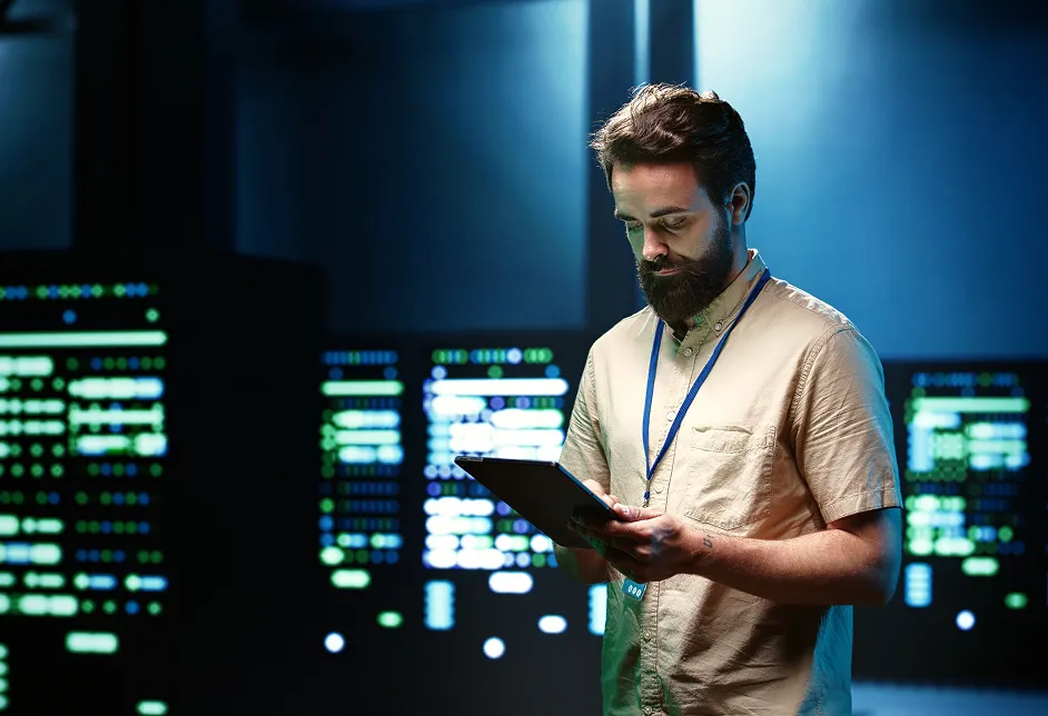 Man using a tablet in a data centre