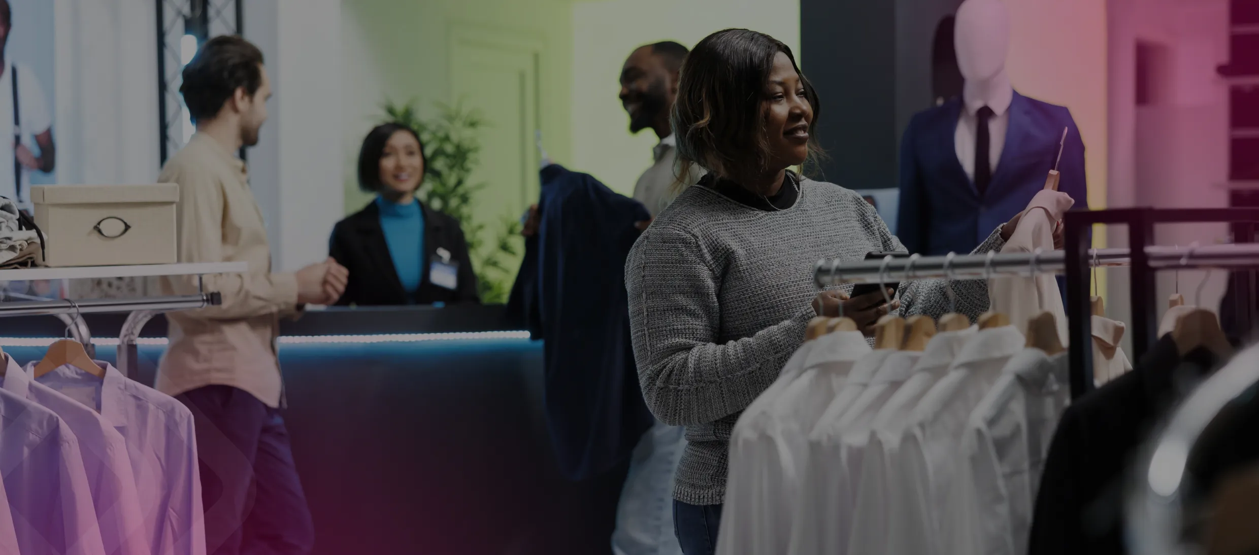 Shop staff among clothing rails