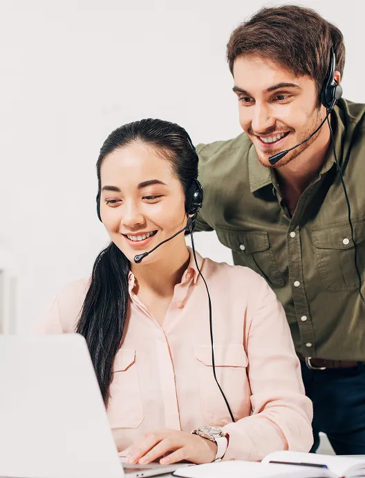 Two call centre agents at a computer