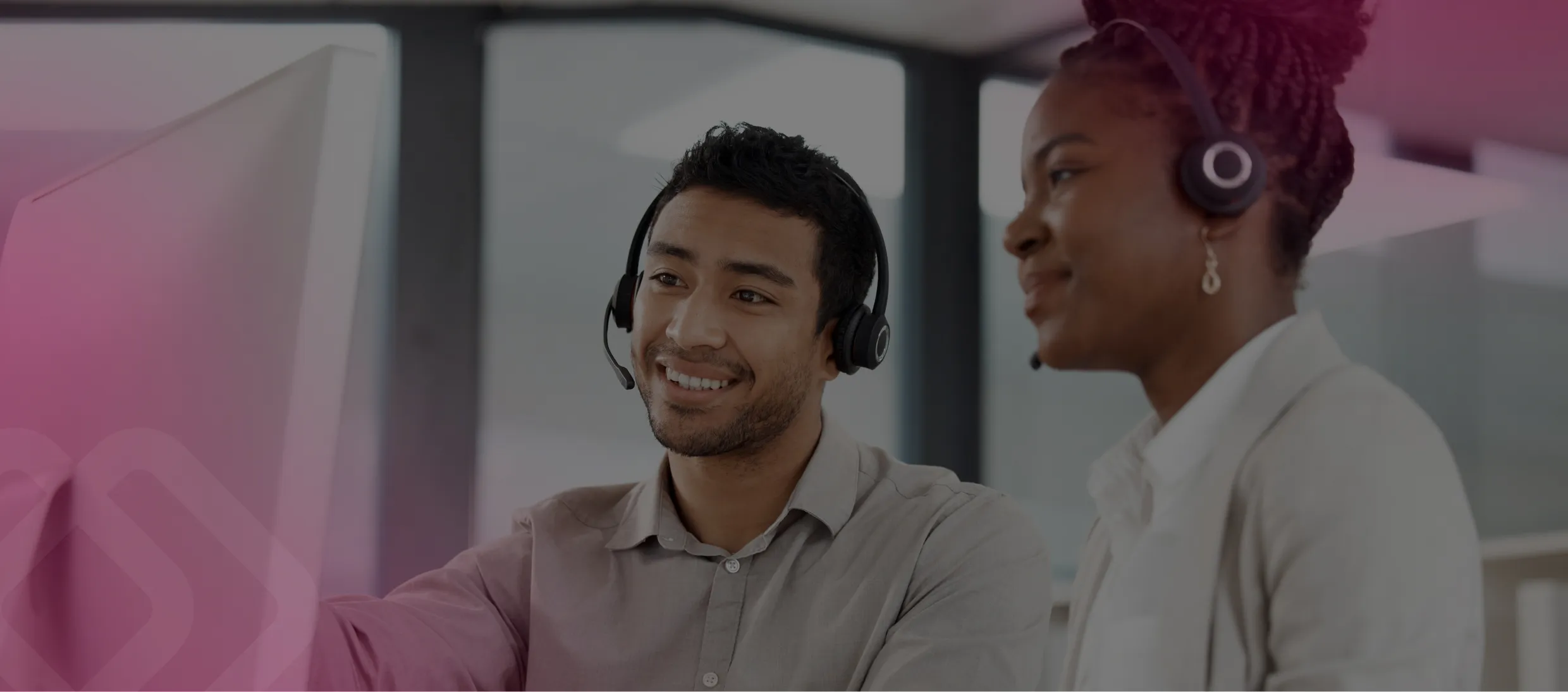 Two call centre agents with headsets