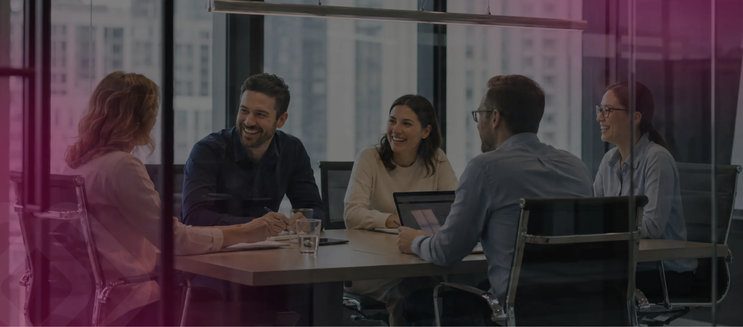 Team meeting in a glass-walled room