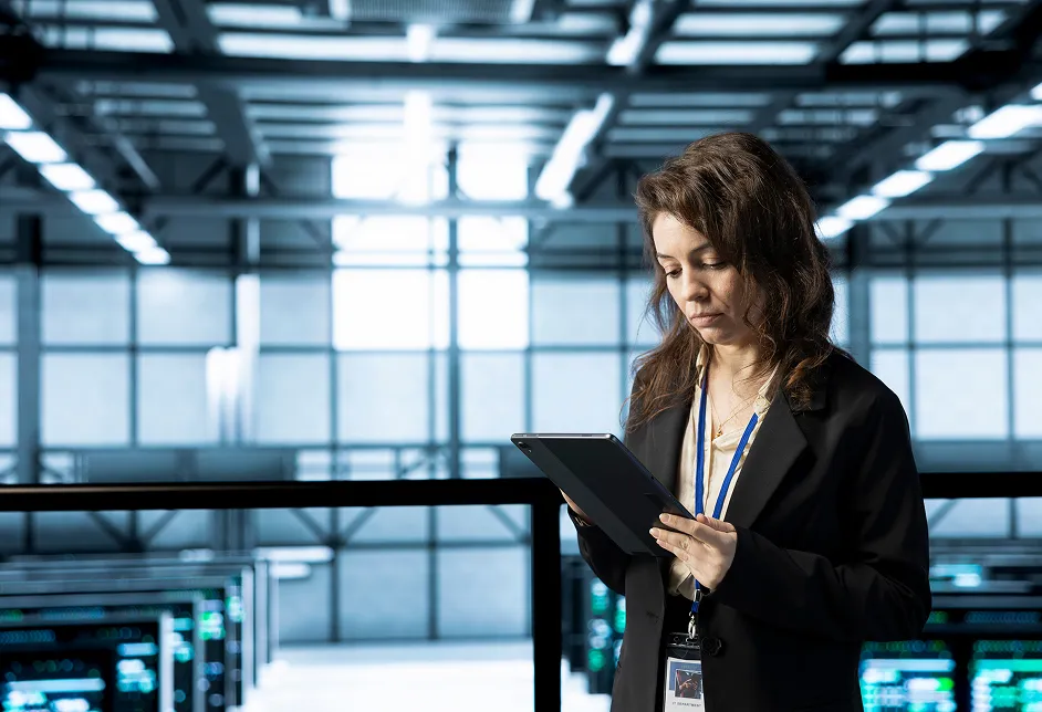 Woman using a tablet in a data centre