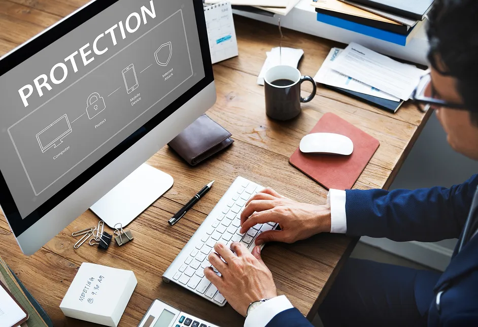 Person at a desk with a security software screen
