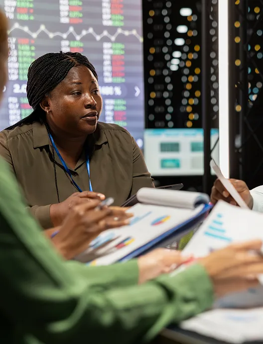 Woman reviewing charts at a meeting