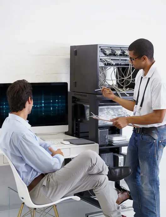 Two technicians at a server workstation