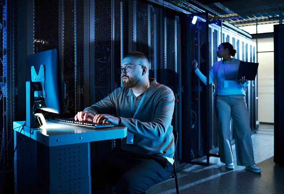 Technicians at a workstation in a data centre
