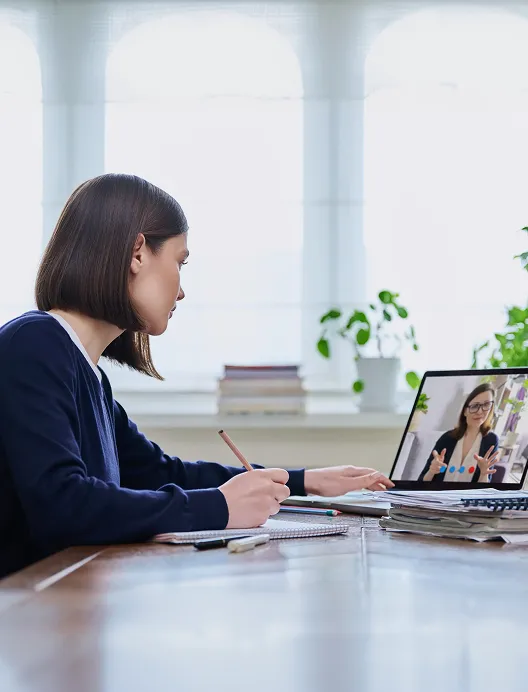 Woman on a video call in a boardroom