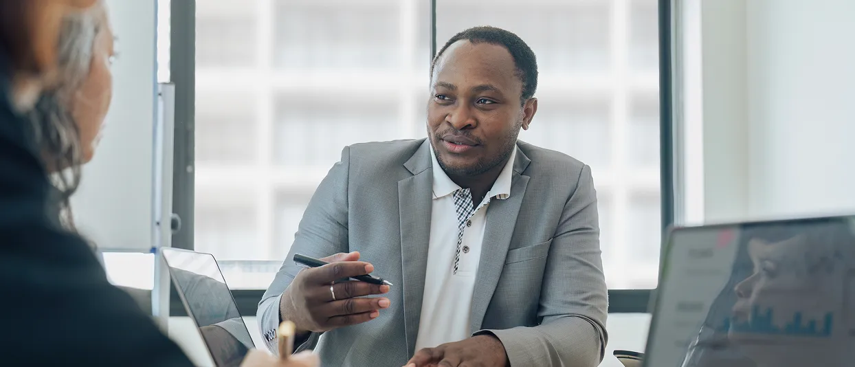 Businessman using a phone at a desk