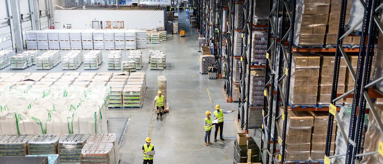 Overhead view of a warehouse aisle with workers