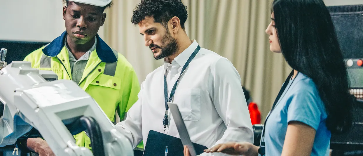Field service workers reviewing equipment with a tablet