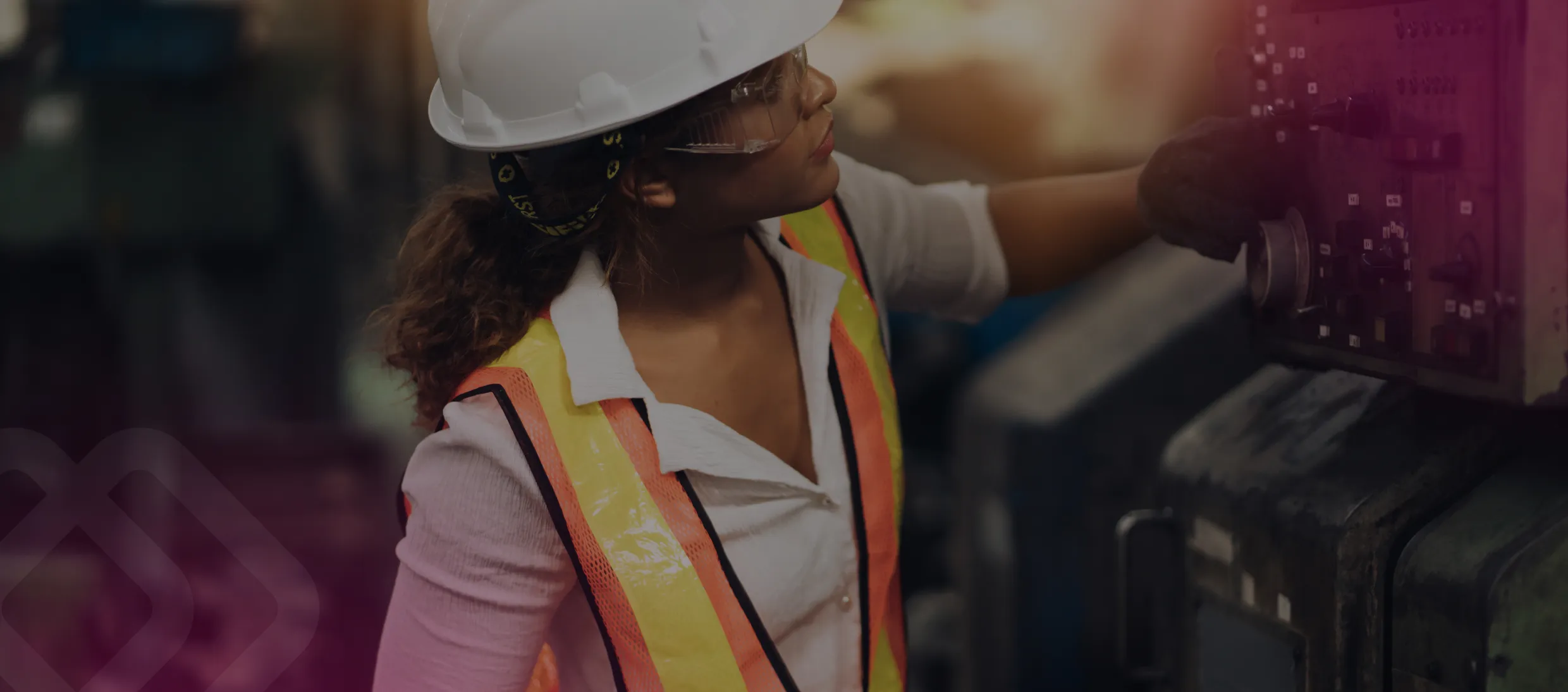 Woman in hi-vis operating machinery