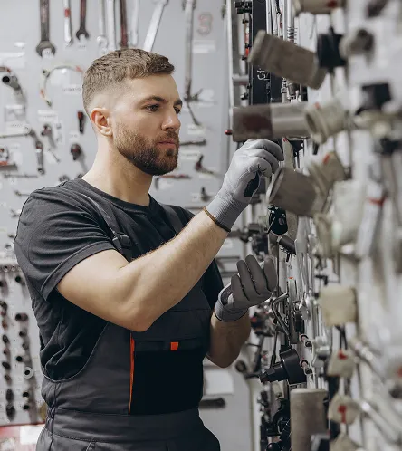 Mechanic selecting parts in a workshop