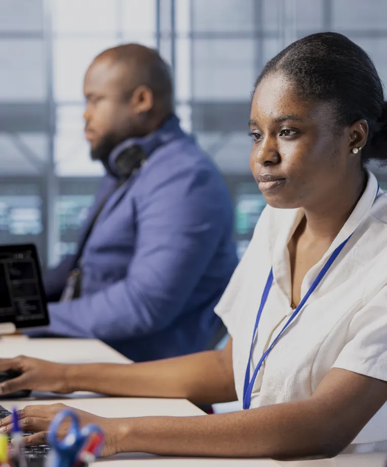 Colleagues working at computers in an office