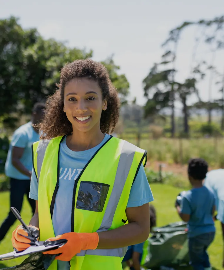 Grounds maintenance worker in hi-vis outdoors