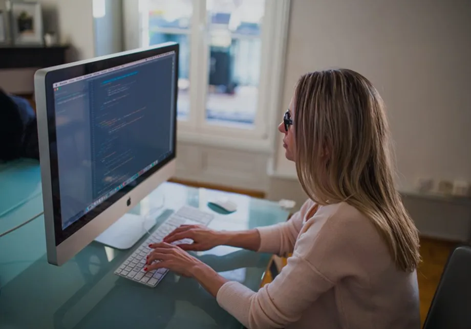 Developer working at a desktop computer