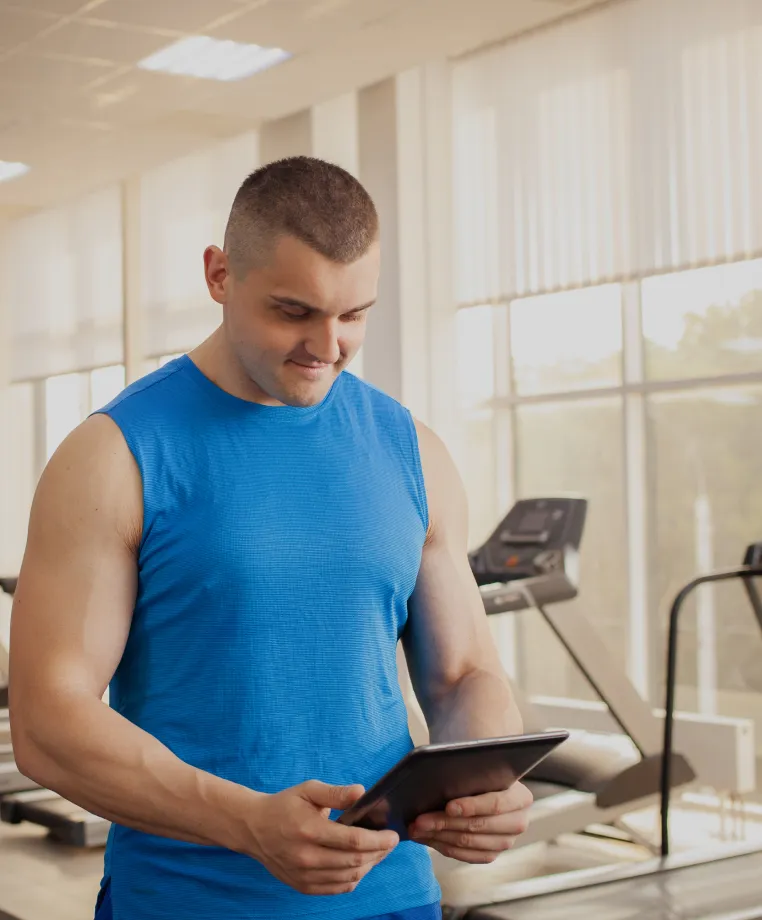 Man using a tablet at a gym
