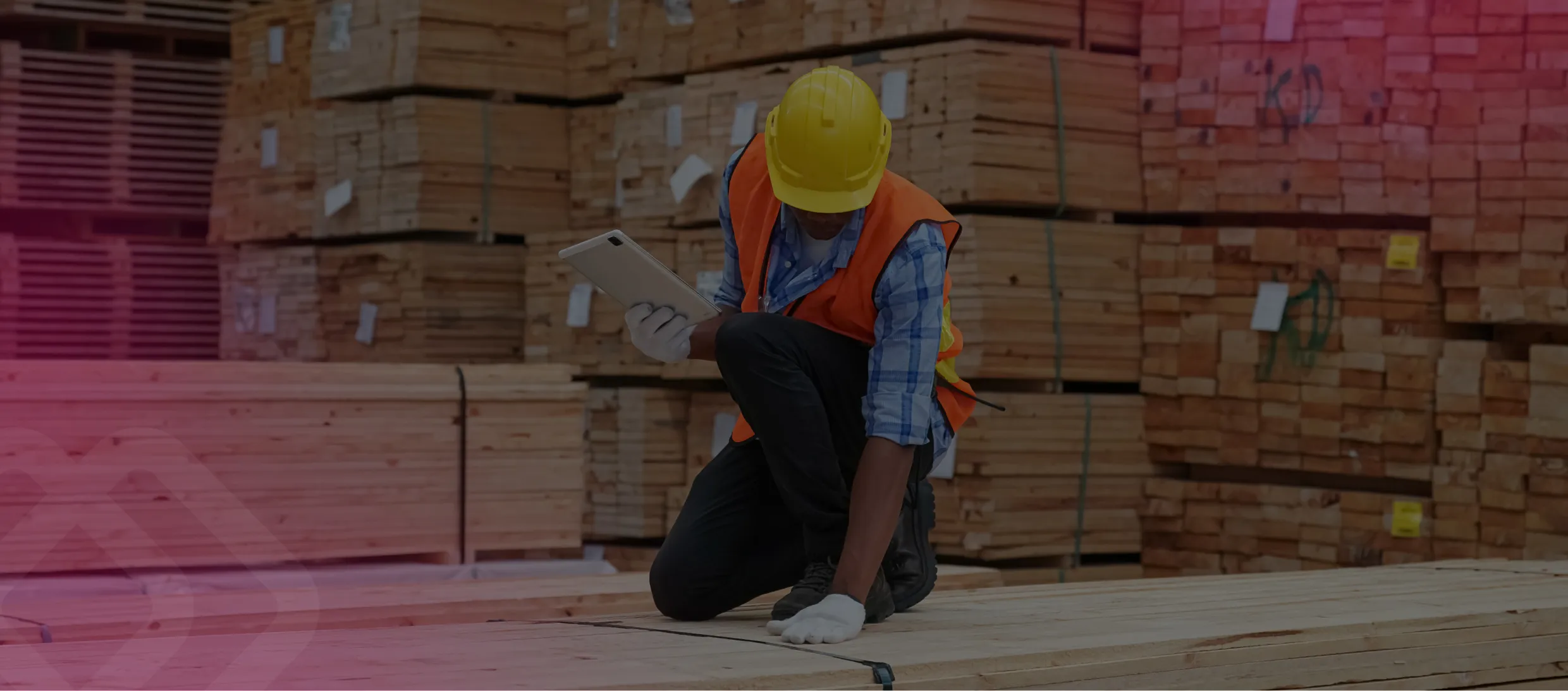 Worker checking stacked timber