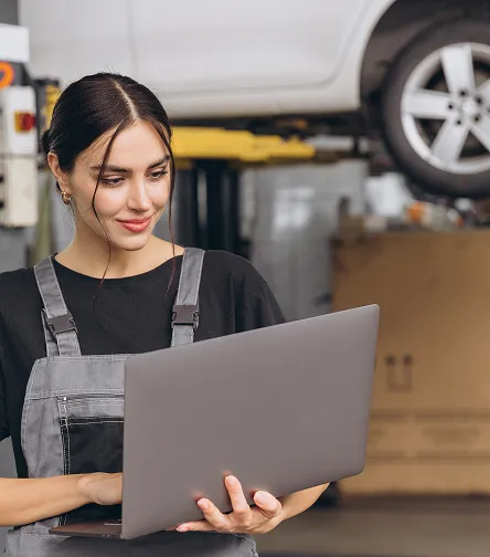 Technician using a tablet in a service shop