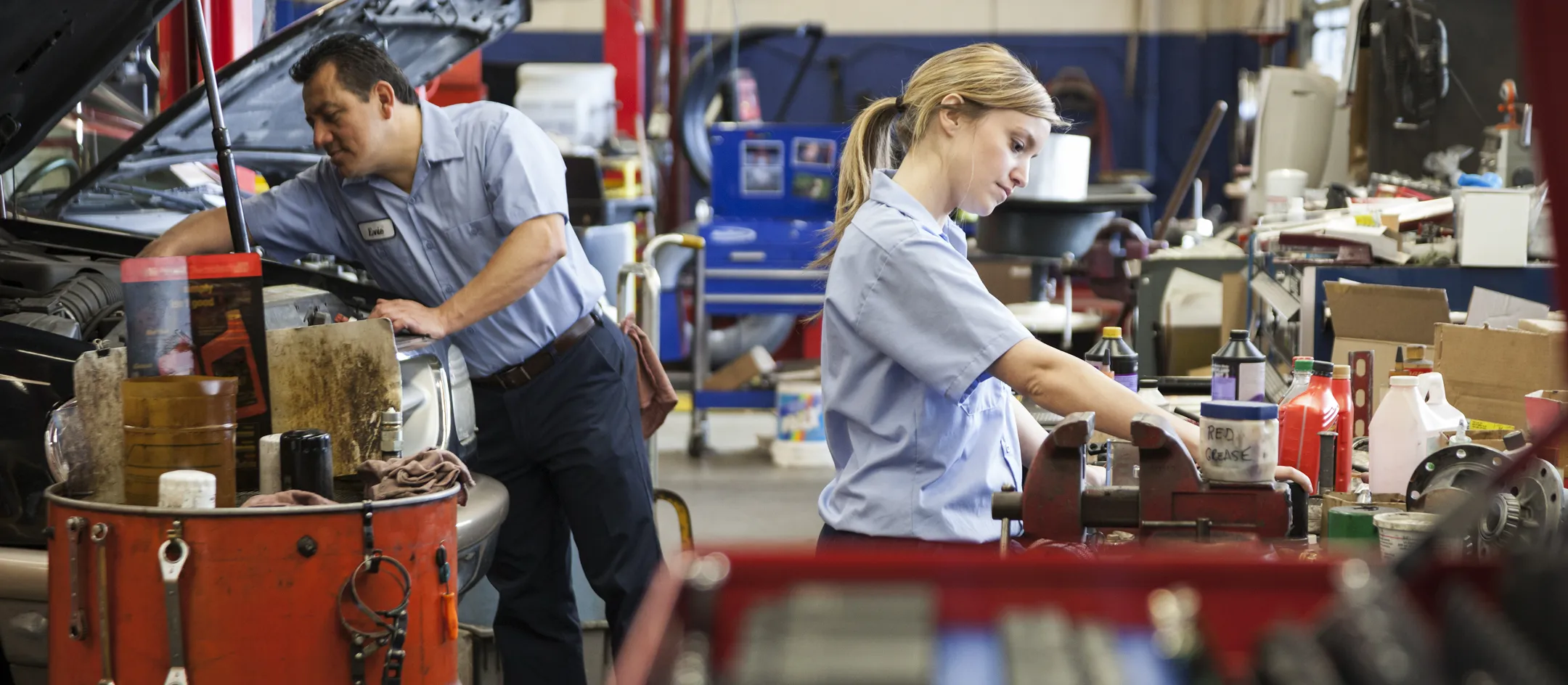 Two technicians working in a service shop