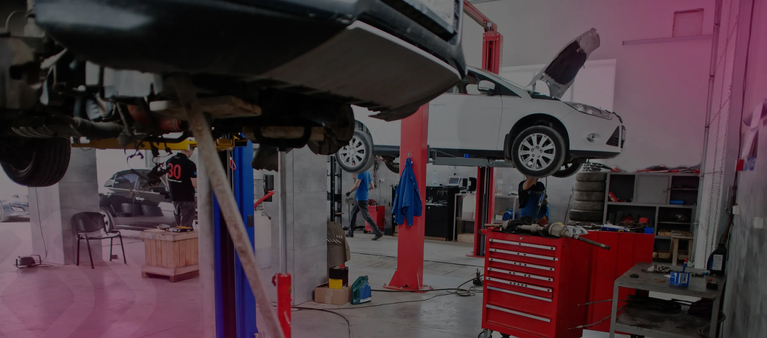 Vehicle on a lift in a service shop