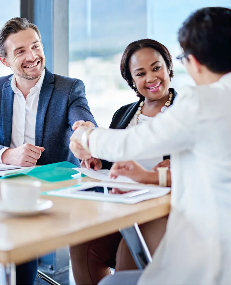 Business handshake at a meeting with a colleague in a lab coat