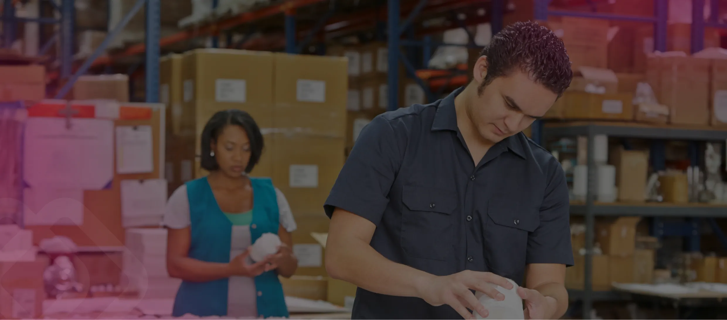 Two colleagues checking stock in a warehouse