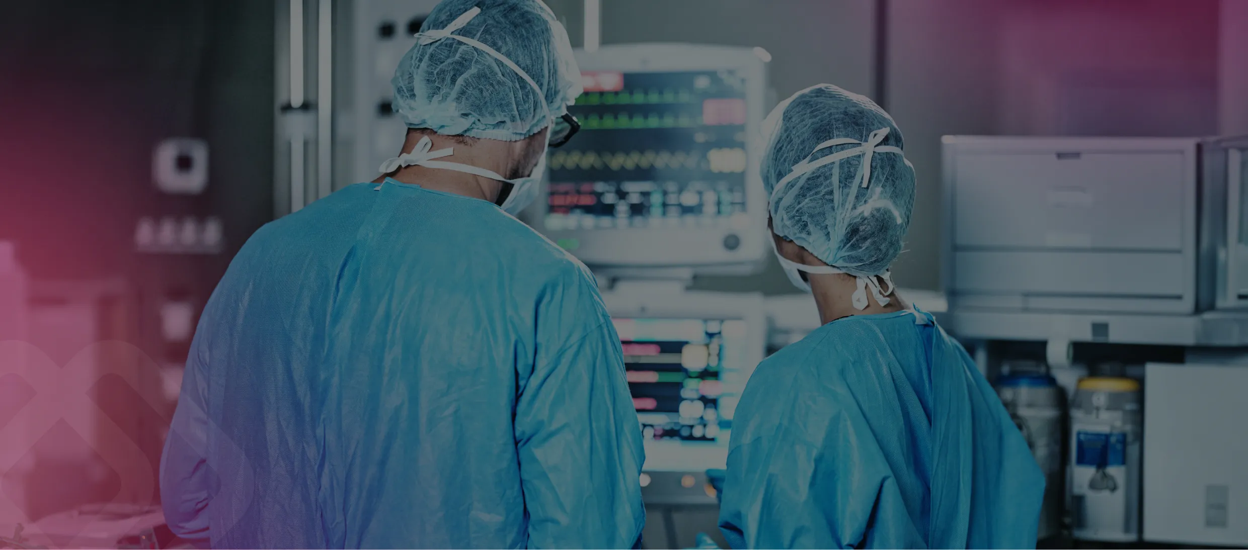 Technicians in scrubs working at equipment