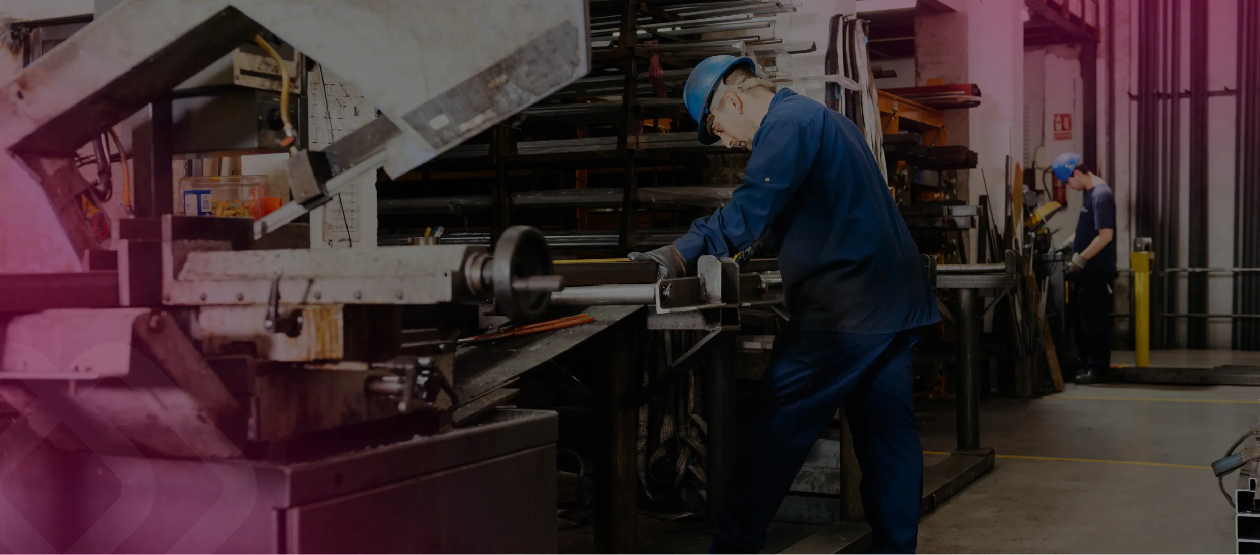 Worker operating a machine in a workshop